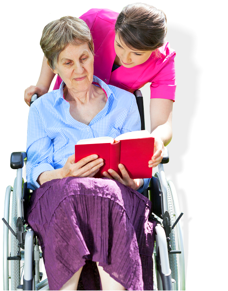 senior woman and caregiver reading a book