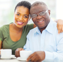 caregiver and senior man smiling