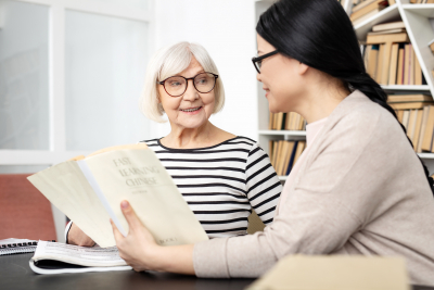 senior woman smiling with her speech therapist