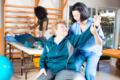 caregivers and seniors doing exercising