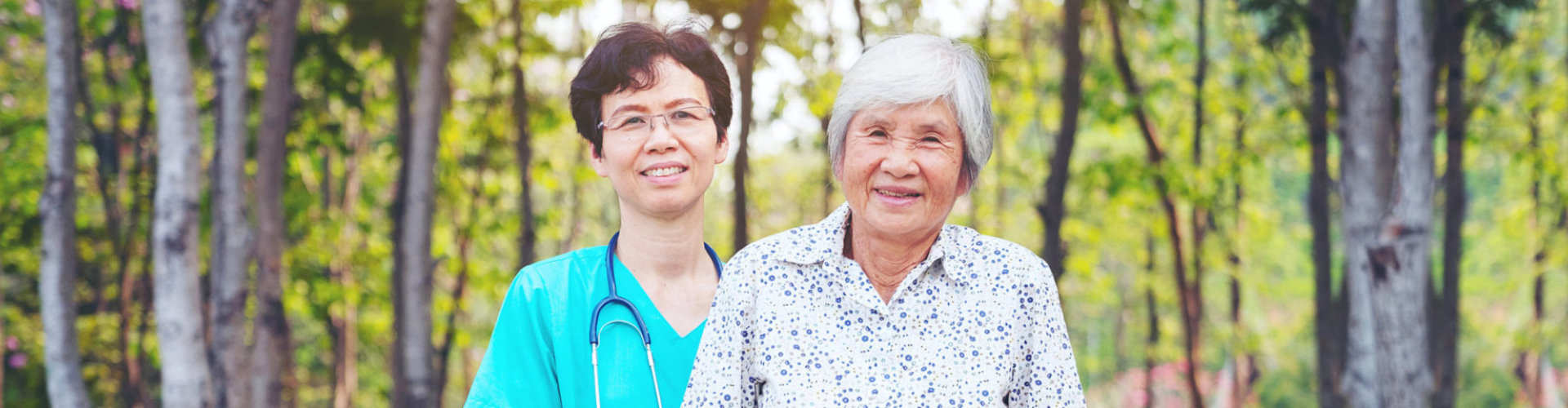 nurse and senior woman smiling